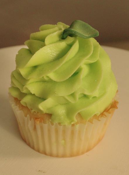 Take a bite of this delicious cupcake with green icing to finish it off!