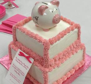 Simple, yet classic for this new little girl. Fluffy tuffs of pink icing line the edges, while a cute little piggy bank keepsake adorns the top. 